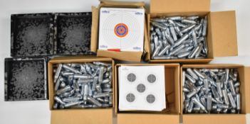A collection of target air rifle and pistol accessories comprising Umarex CO2 canisters, paper