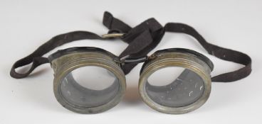 A pair of aviation goggles of alloy construction, with strap
