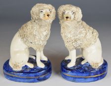 Opposing pair of Staffordshire spaniels / dogs, height 15cm