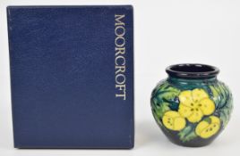 Moorcroft pedestal vase decorated in the Buttercup pattern, in original box, height 7.5cm