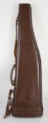 Leather leg of mutton shotgun case with shoulder strap, 76cm long.