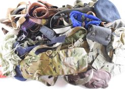 Collection of military belts, slings, straps, gaiters and pouches