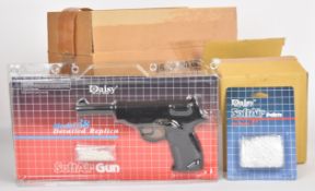 Three Daisy Model 38 airsoft pistols with 12 packs of associated pellets, all sealed in original