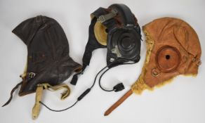 Russian Cold War leather flying helmet with throat microphone attachment, together with two other