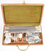 12 bore shotgun cleaning kit with ebony and brass rods, chrome oil bottles etc, unused in hardwood