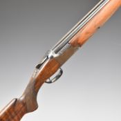 Browning B25 A1 12 bore over and under ejector shotgun with chequered semi-pistol grip and forend,