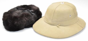 Russian rabbit fur cold weather hat by Elektra and a pith helmet by Chop Sin Yin Leong, Singapore