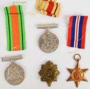 British WW2 medals comprising Africa Star, Defence Medal and War Medal with postal box for Mr R B