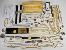 A collection of costume jewellery including filigree cross, silver ring, faux pearls, silver