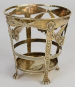 Edward VII hallmarked silver condiment basket with lion mask decoration and raised on lion paw feet,