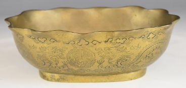 Chinese brass bowl with fluted rim, dragon decoration and seal mark to base, L22xD16.5xH7cm.