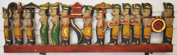 Eastern carving of a procession and a 19thC carved hardwood frieze, longest 97cm