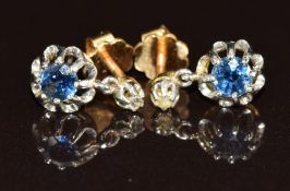 A pair of 18ct gold earrings each set with a round cut sapphire of approximately 0.2ct and a rose
