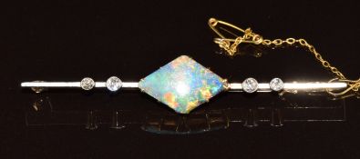 A c1920 9ct gold brooch set with black opal and four diamonds with a platinum finish, 5.5g, 6cm