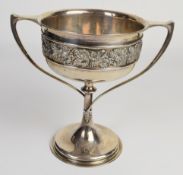 George V hallmarked silver twin handled pedestal trophy bowl or cup with vine decoration,