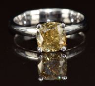 A platinum ring set with a 2.14ct deep yellow/green cushion cut diamond, with certificate, 4g,