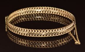 A 9ct gold bangle made up of two rows of curb links, 13.4g, 4.8 x 6cm