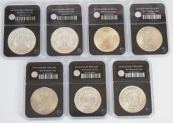 Seven United States of America slabbed silver dollars, comprising 1889, 1921, 1922, 1923, 1924, 2014