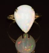 A 9ct gold ring set with a pear cut opal cabochon, 3.5g, size P