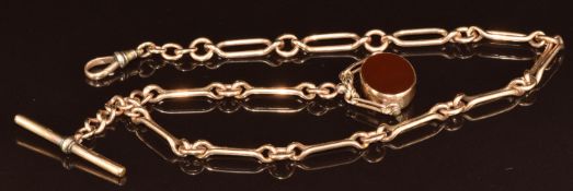 A 15ct gold Albert / watch chain made up of twisted elongated links and circular links (47g) with