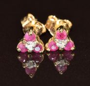 A pair of 9ct gold earrings each set with rubies and diamonds, 0.6g