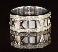 An 18ct white gold ring with Roman numeral decoration '2149' and set with twenty eight diamonds,
