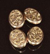 A pair of Victorian 9ct gold cufflinks with scrolling decoration, Chester 1899, 3.8g