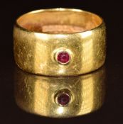 A 22ct gold wedding band / ring set with a ruby, 9.5g, size O