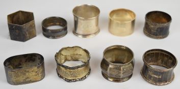 Eight various hallmarked silver napkin rings and a further American example marked sterling,