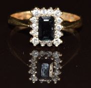 A 9ct gold ring set with a sapphire and cubic zirconia, 2g, size P