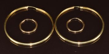A pair of 18ct gold hoop earrings (7.9g) and a pair of 9ct gold hoop earrings (0.9g)