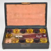 Georgian / Victorian cased set of twelve glass intaglio seals, the case with faceted cut glass