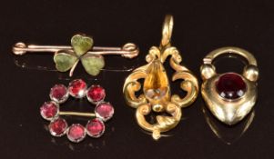 Victorian yellow metal heart padlock clasp set with a garnet cabochon and verso a locket compartment