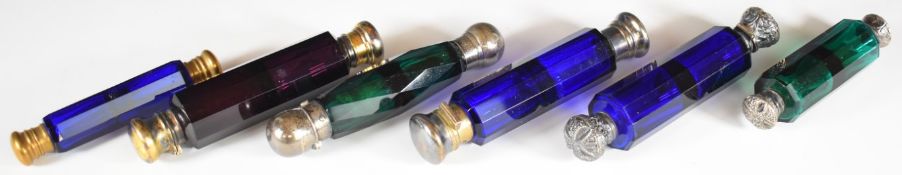 Six blue and green glass double ended scent / perfume bottles with hallmarked silver / white metal
