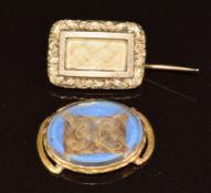 Victorian mourning brooch set with hair and a yellow metal Victorian buckle set with hair and