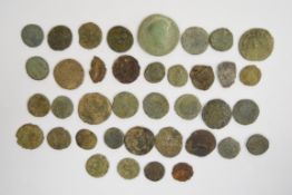 A collection of 37 largely uncleaned Roman coins, includes two silver examples 'Romulus and Remus'