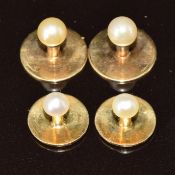 Two 9ct gold Ciro studs set with faux pearls (1.8g) and two yellow metal studs each set with a pearl
