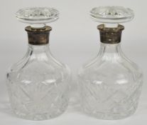 Pair of Elizabeth II hallmarked silver mounted cut glass decanters, Birmingham 1973, maker W I