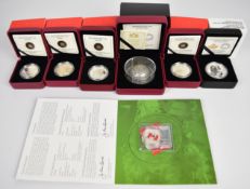 Seven Royal Canadian Mint fine silver coins comprising four 2013 $10 coins (Wolf, Hockey, Orca and