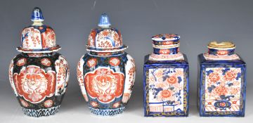 A pair of 19thC Japanese Imari tea caddies and pair of fluted vases, tallest 25cm