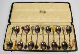 Cased set of twelve Liberty spoons, each with a coloured stone finial, Birmingham 1925, maker
