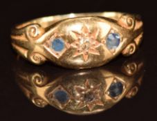 A c1910 18ct gold ring set with a diamond and sapphires, 2.6g, size H