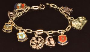 A 9ct gold charm bracelet with nine charms including enamel set thistles, moon & owl, etc, 16.7g,