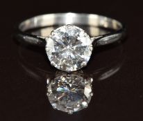 A platinum ring set with a round cut diamond of approximately 1.5ct, 3.4g, size O