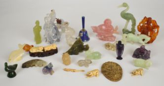 A collection of mainly Chinese jade or similar hardstone / glass / bone figures including mother