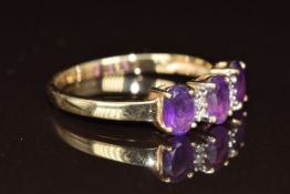 A 9ct gold ring set with three oval cut amethysts and diamonds, 2.5g, size S