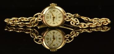Tudor Royal 9ct gold ladies wristwatch with gold hands and hour markers, white dial and signed 21