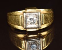 An 18ct gold ring set with a round cut diamond of approximately 0.35ct in a square setting, 13.2g,