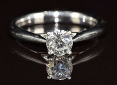 A platinum ring set with a 0.6ct round cut diamond, with certificate, 5.4g, size L