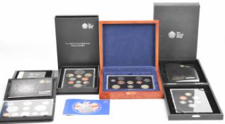 Four Royal Mint proof coin sets comprising 2012, 2008 Royal Shield of Arms and 2008 and 2004